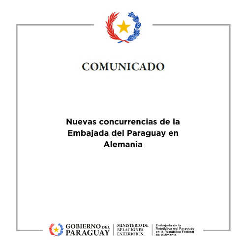 Desk with leather desk pad, walnut desk organizer, wireless keyboard and mouse, and porcelain mug.